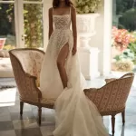 Square A-line lace and beads wedding gown with slit.