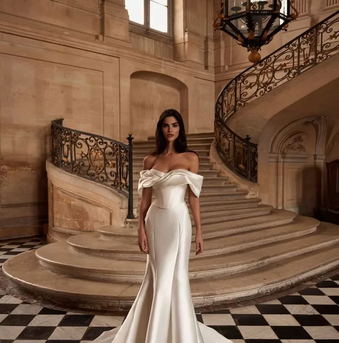 plain fitted off the shoulder wedding gown.