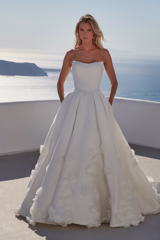 couture A-line Mikado wedding gown with flowers on the skirt.