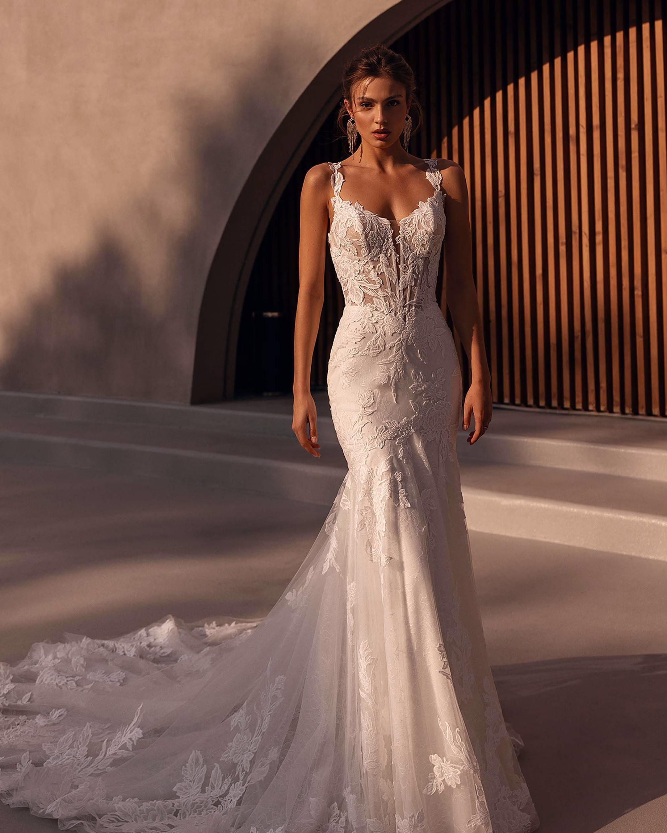 Demetrios Style 1505 A-line wedding dress with a pearl-accented corset bodice, layered tulle skirt, romantic silhouette, and elegant train.