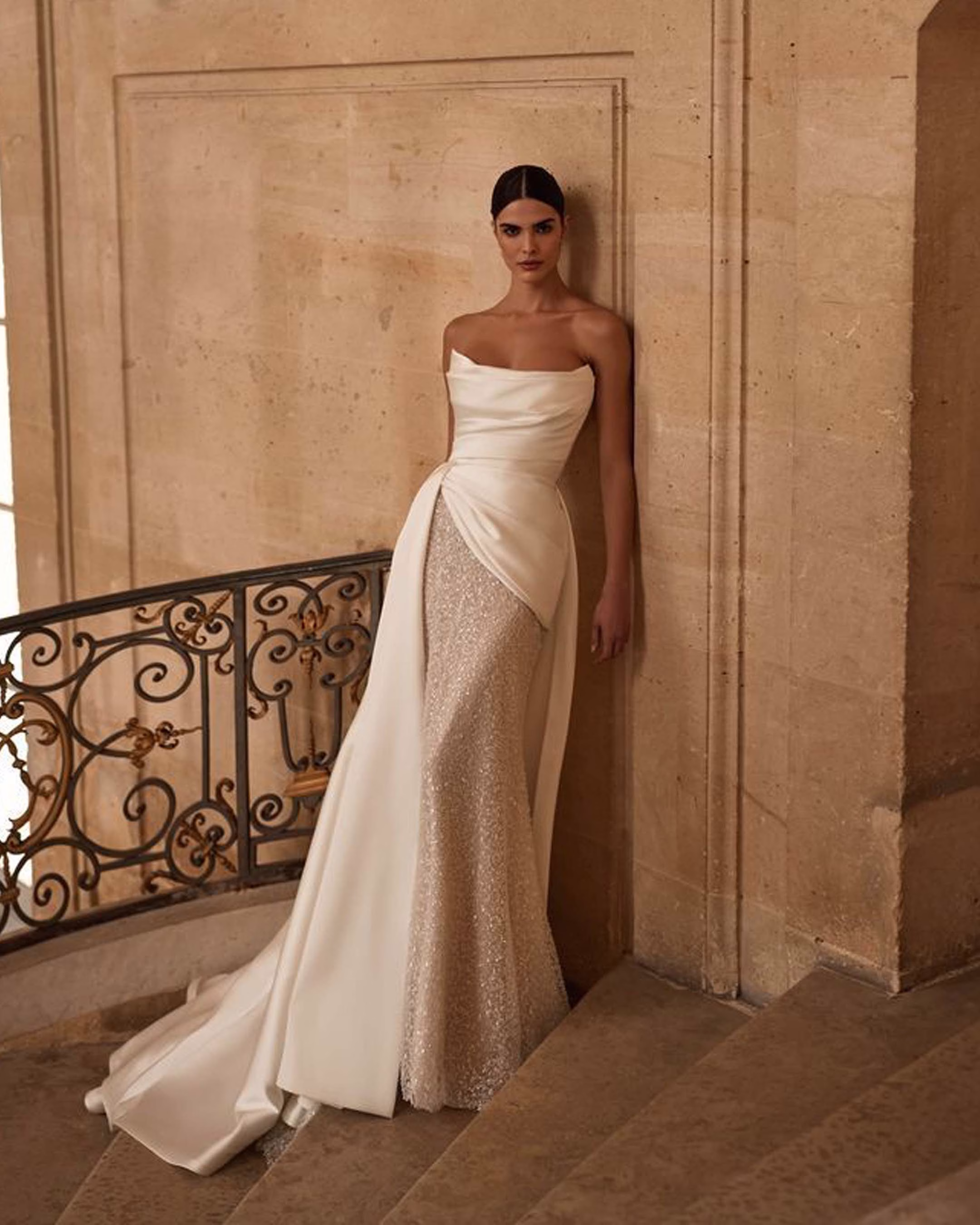 Milla Nova Aminata sequined lace mermaid wedding dress with a sweetheart neckline, boned corset bodice, fitted skirt, and short train.