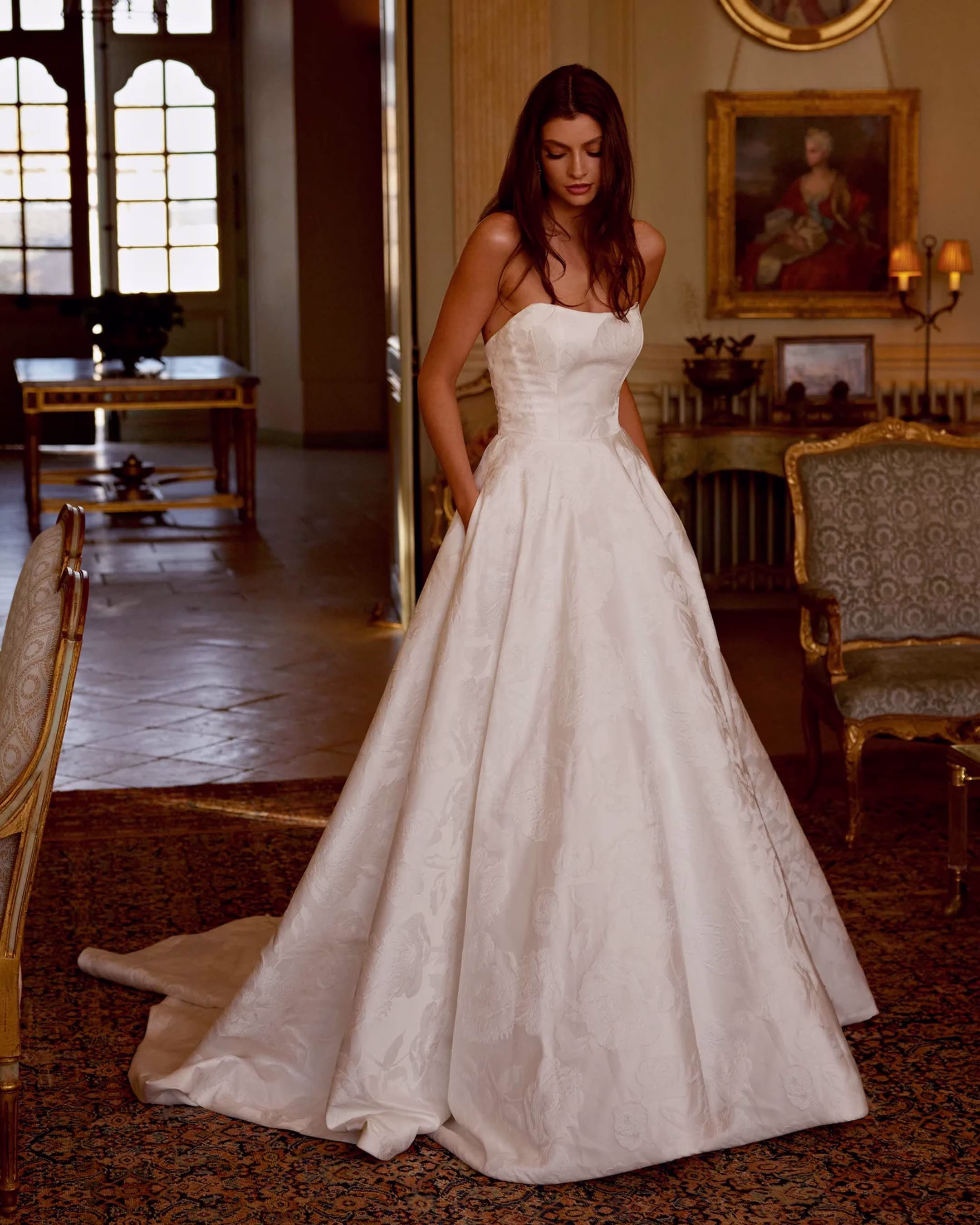 Justin Alexander Josette fit-and-flare wedding dress featuring a beautifully detailed lace bodice, flattering silhouette, elegant train, and timeless bridal style.