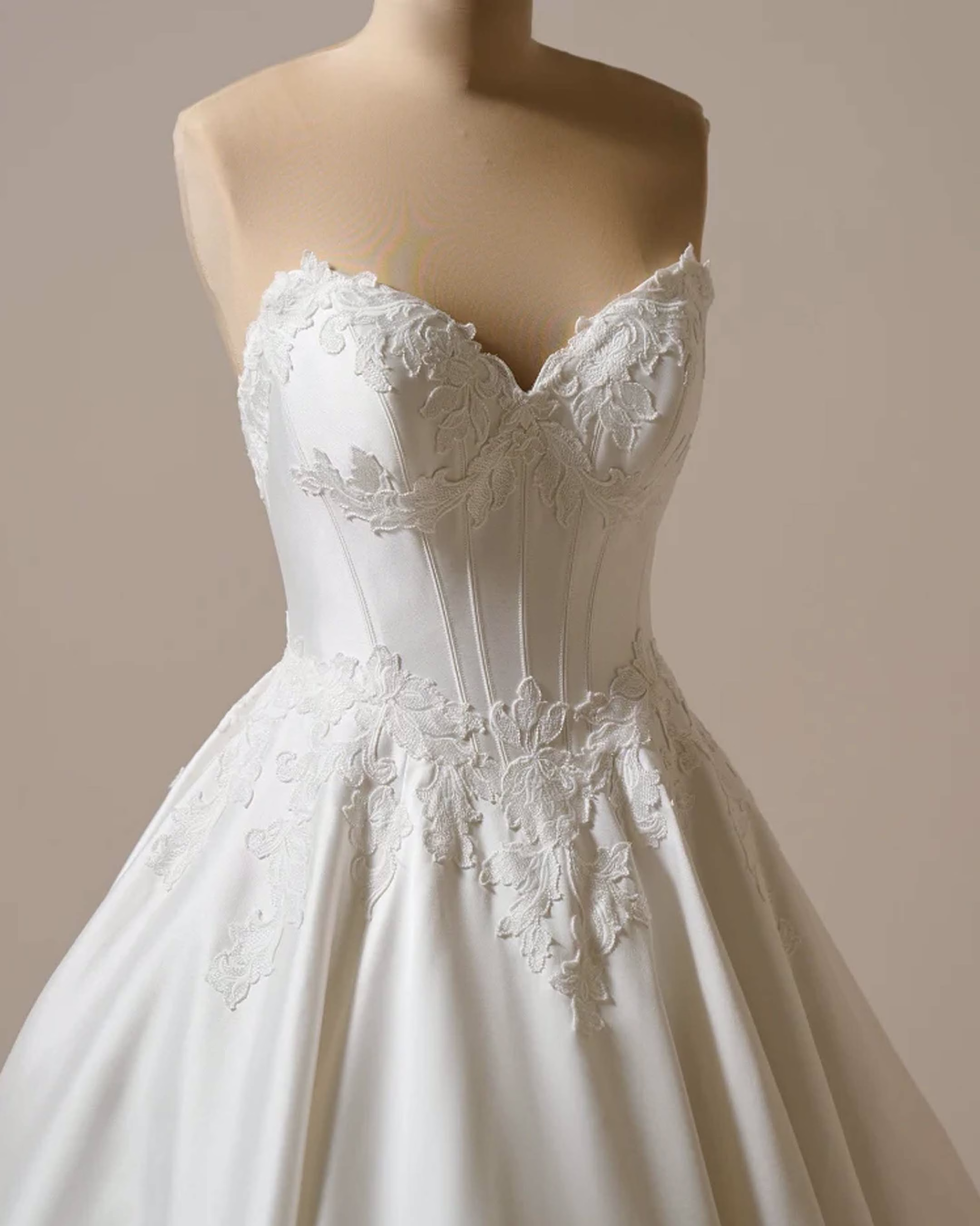 Maggie Sottero Serafina A-line wedding dress featuring romantic lace details, a flattering silhouette, flowing skirt, and elegant bridal train.