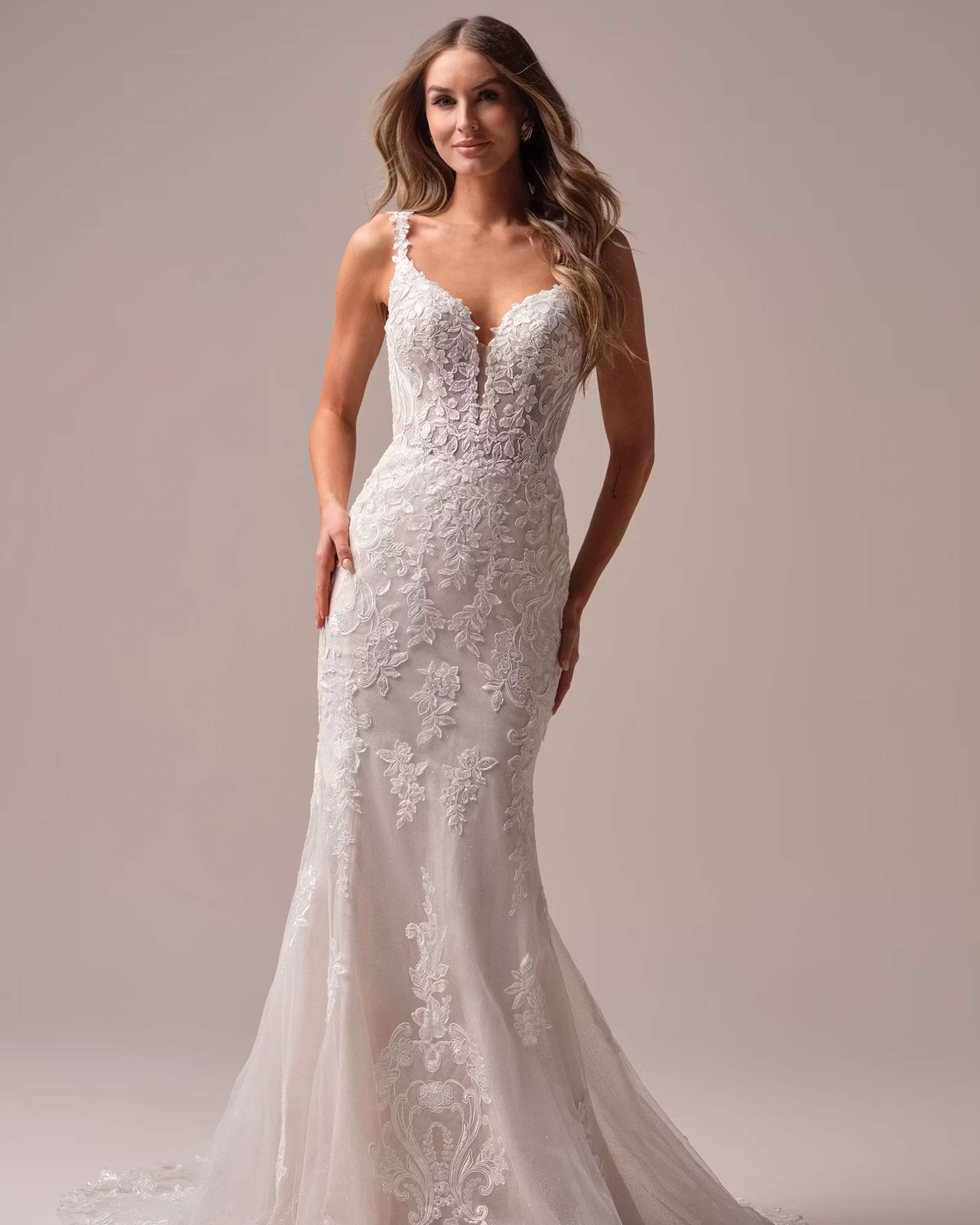 Rebecca Ingram Candice mermaid wedding dress featuring sequin floral lace, plunging V-neckline, illusion bodice, and elegant scalloped train.