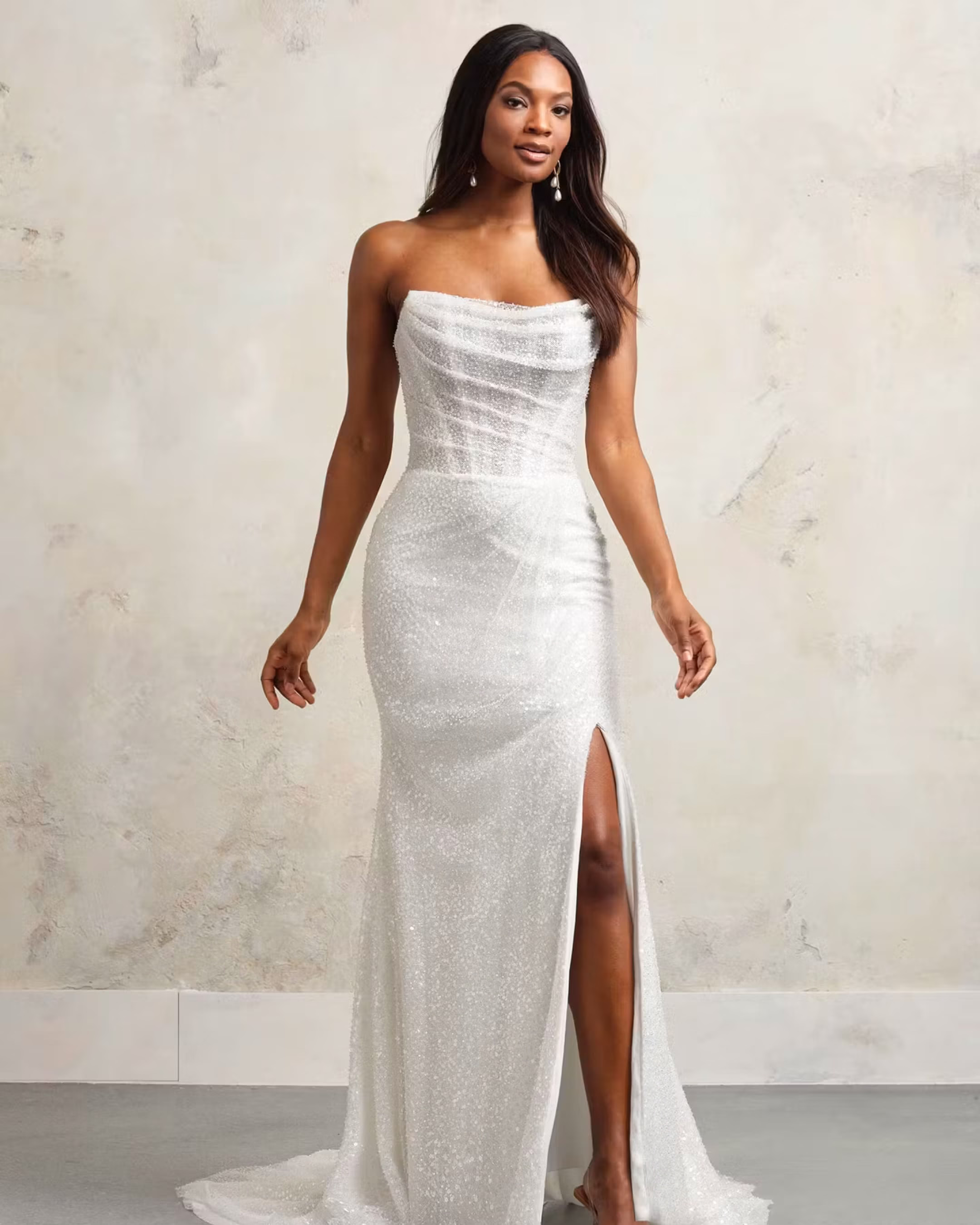 Maggie Sottero Ashley A-line wedding dress featuring romantic lace details, a flattering silhouette, flowing skirt, and elegant bridal train.