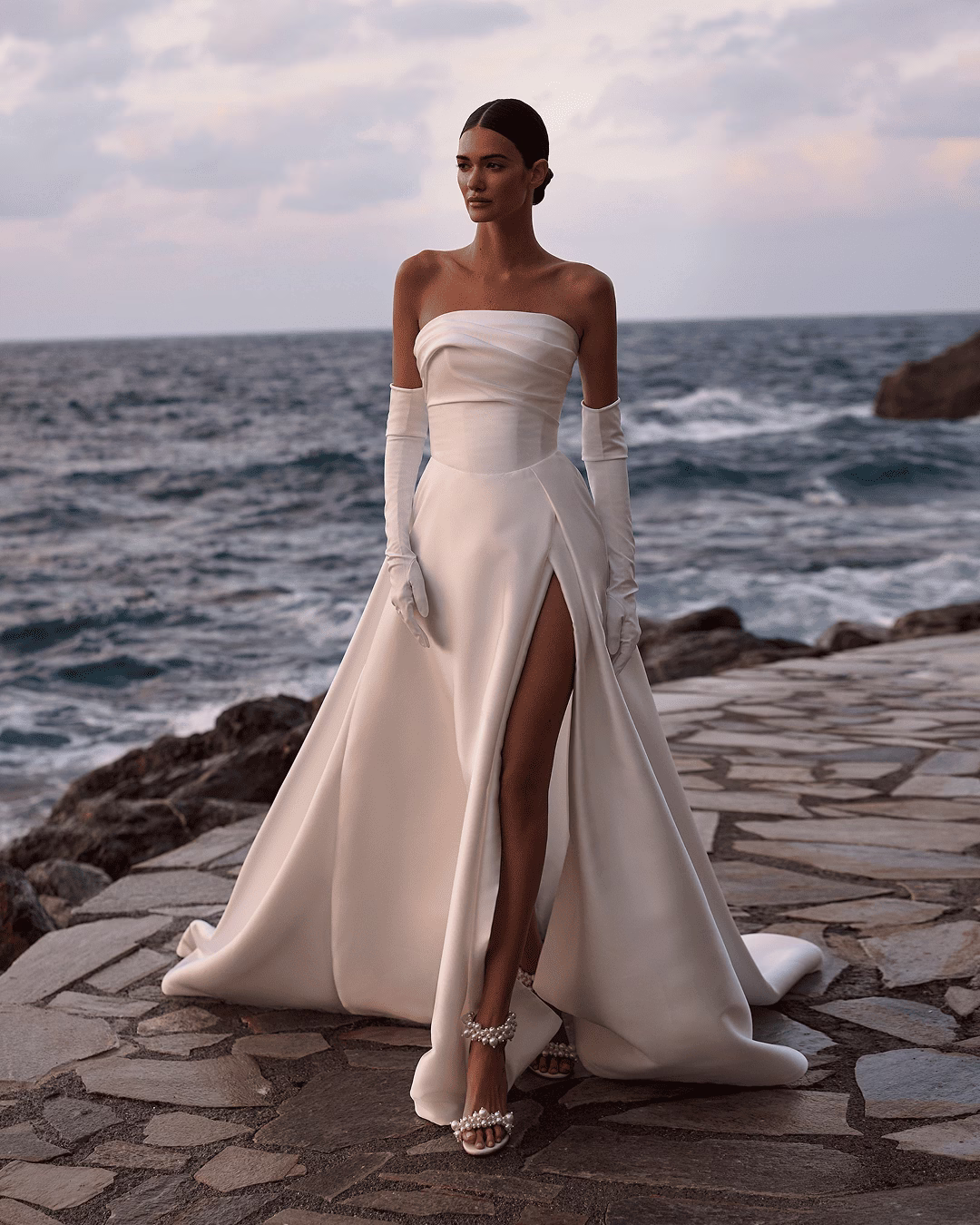 Milla Nova Bloom mikado A-line wedding dress with a draped straight neckline, fitted corset bodice, full princess skirt, and soft train.