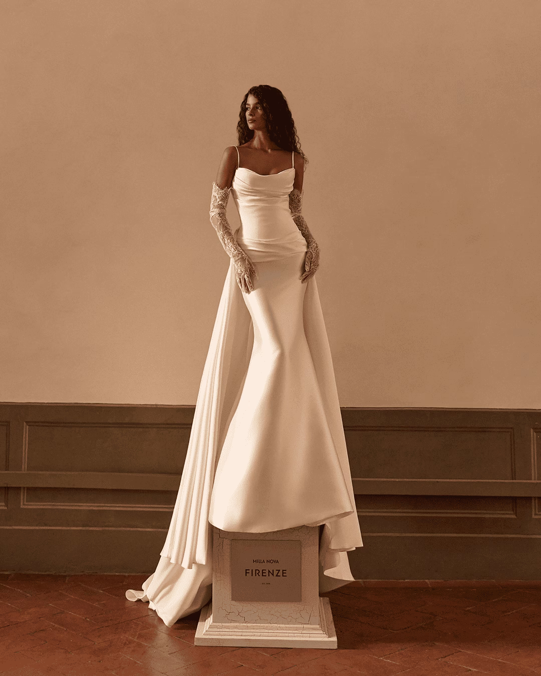 Milla Nova Clarienne mikado mermaid wedding dress with delicate spaghetti straps, draped details, and a sleek figure-flattering silhouette.