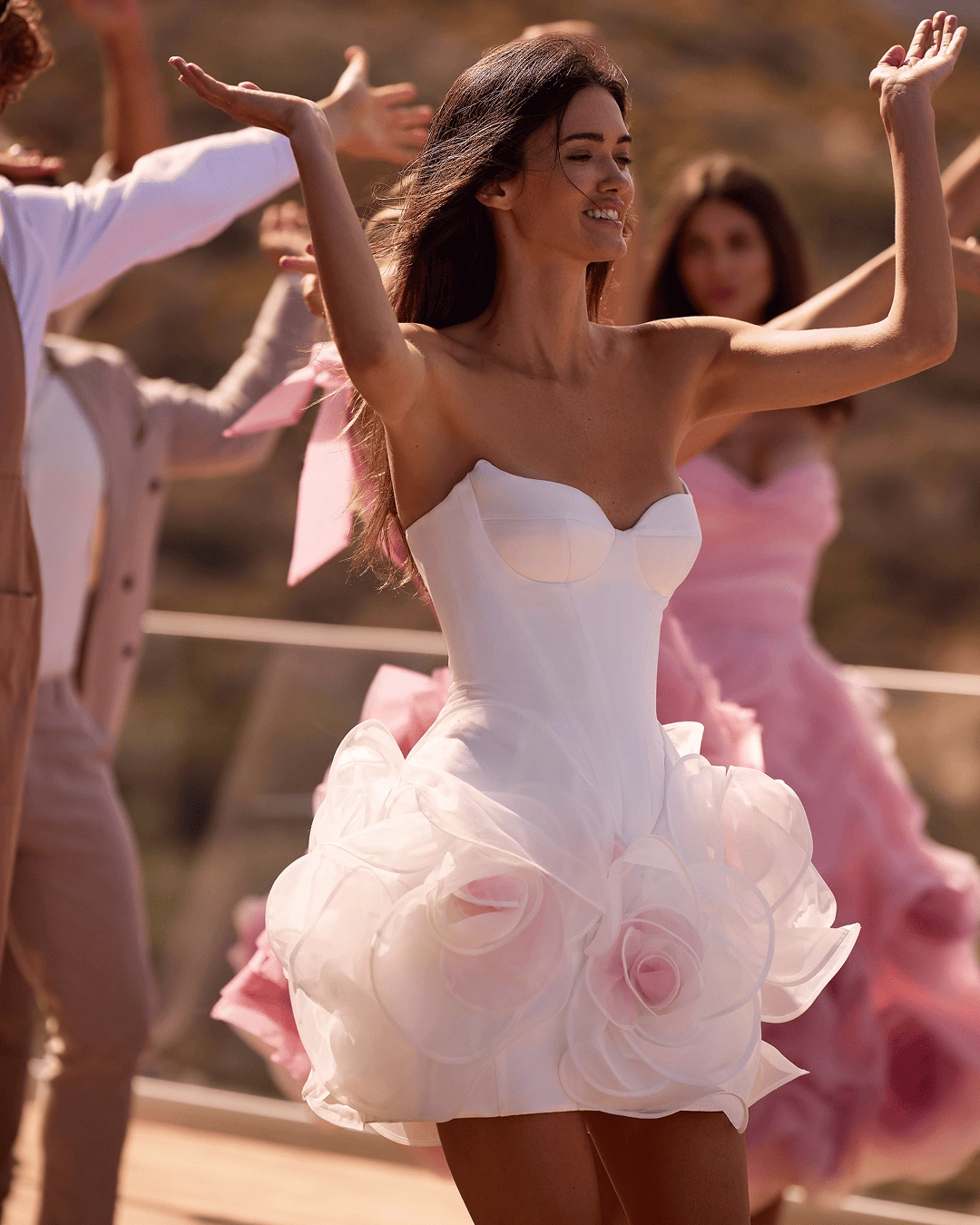 Milla Nova Elvania satin and organza mini wedding dress with a heart-shaped neckline, corset bodice, spaghetti straps, visible boning, and 3D floral organza skirt.