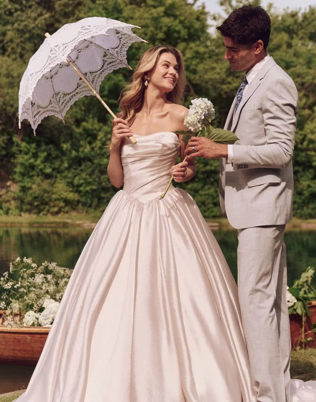 Maggie Sottero Paris A-line wedding dress featuring romantic lace details, a flattering silhouette, flowing skirt, and elegant bridal train.