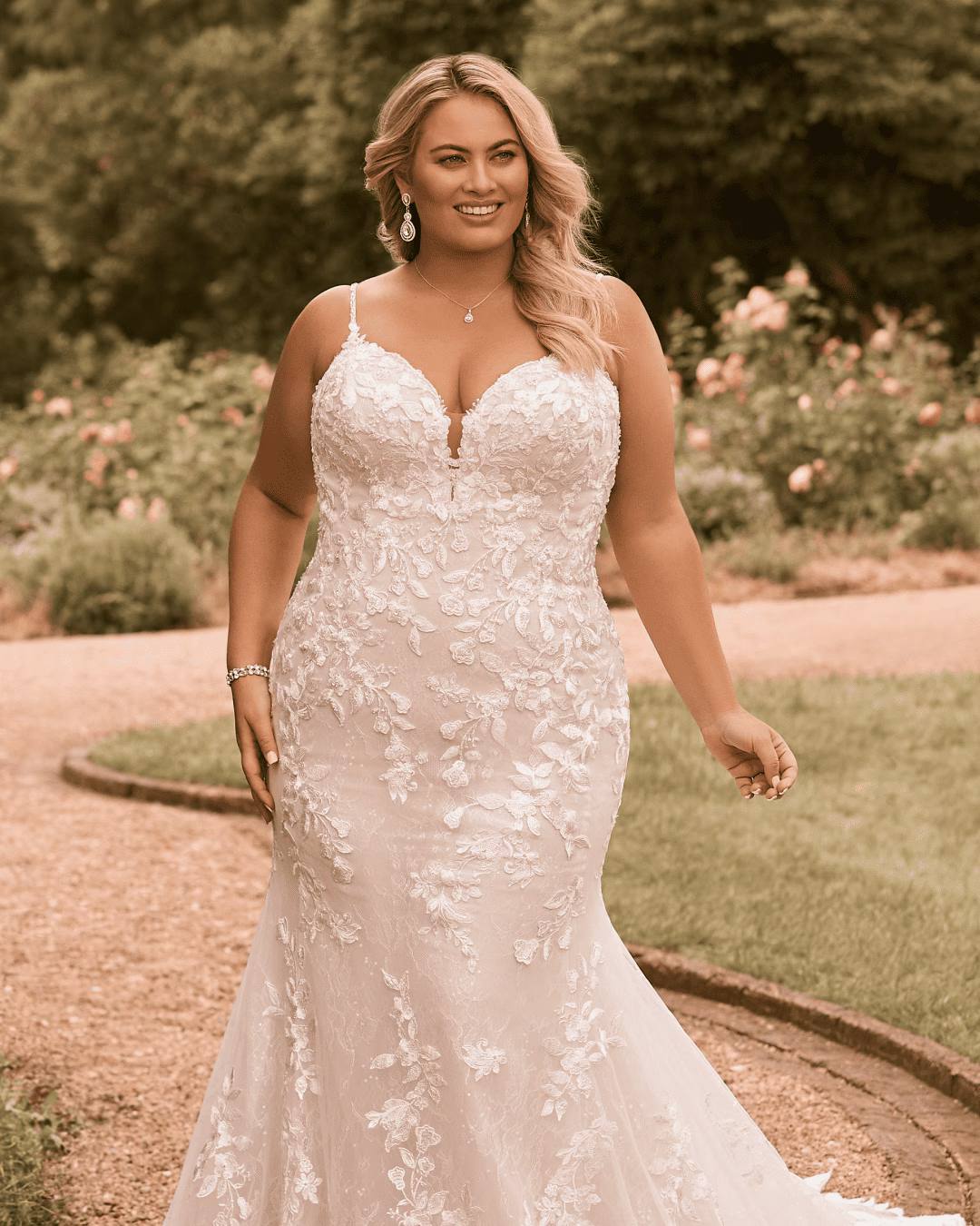 Sophia Tolli Valentina Y22171 lace fit-and-flare wedding dress with a V-neckline, beaded spaghetti straps, illusion lace back, floral lace appliqués, and a scalloped train.