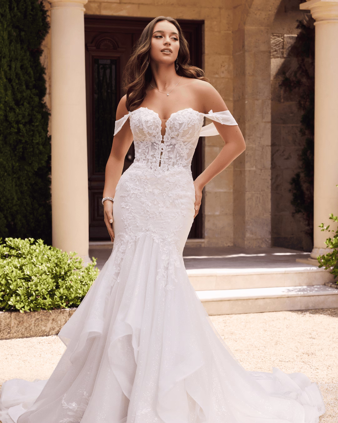 Sophia Tolli Elvie Y3124 glitter fit-and-flare wedding dress with a deep V-neck sweetheart bodice, floral sequined lace appliqués, sheer illusion back, detachable off-the-shoulder straps, and a dramatic glitter train.