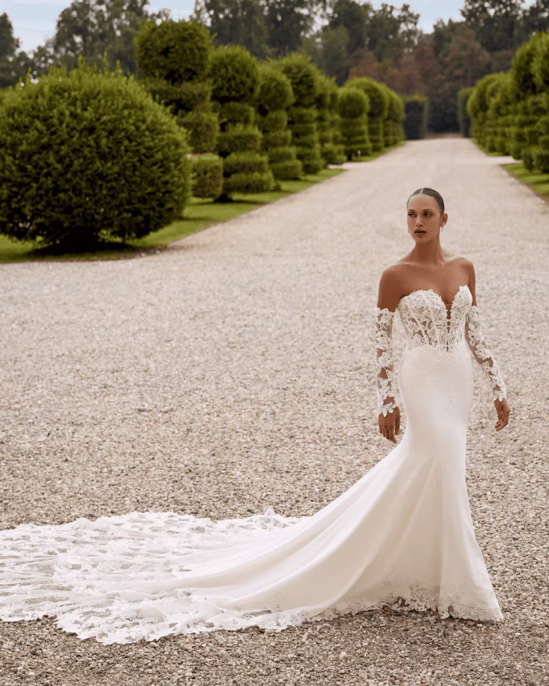 Justin Alexander Hope A-line wedding dress featuring a structured bodice, flowing skirt, romantic silhouette, and elegant train.